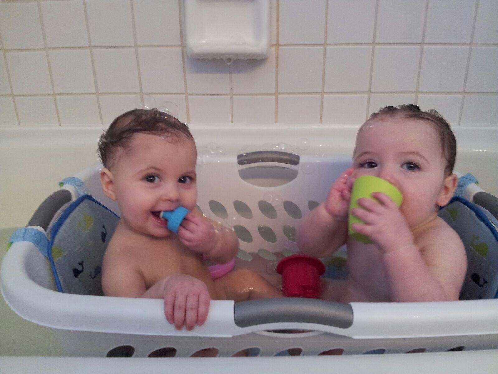 bathing twins in a laundry basket